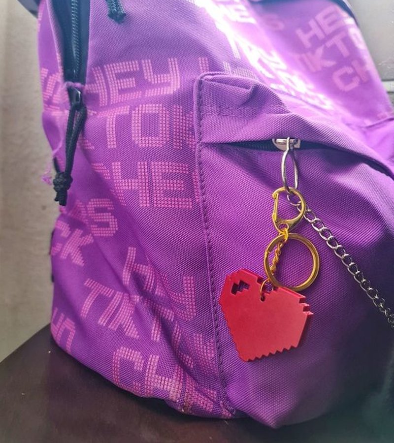 Pixel Heart Gaming Keychain Charm on a back to school bookbag