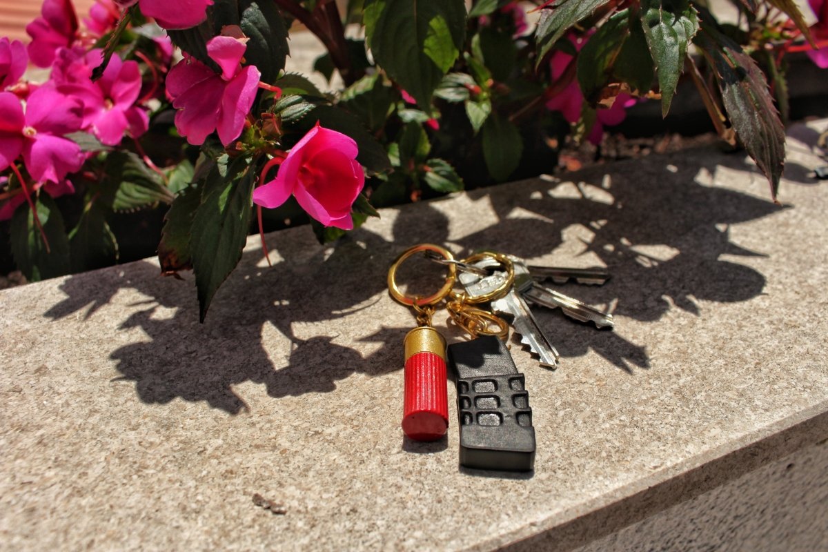 a mini rifle magazine and shotgun shell 3d printed keychain