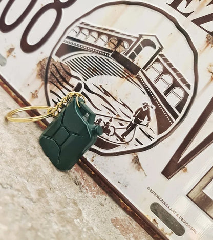 Mini Jerry Can Keychain charm next to a license plate 