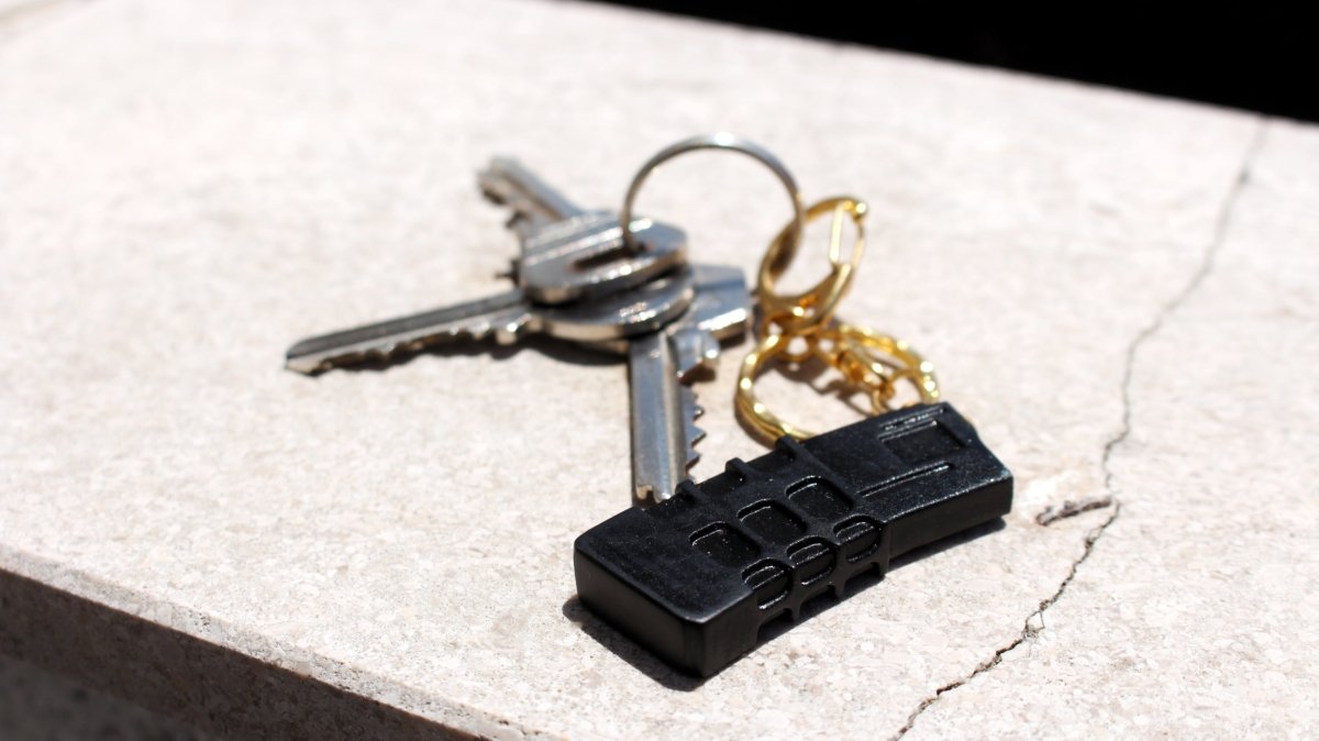 A set of keys and a mini rifle magazine shell 3d printed keychain 
